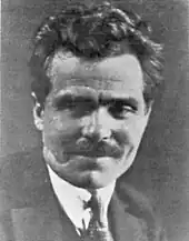 Portrait photograph of Nestor Makhno, wearing a moustache and messy hair