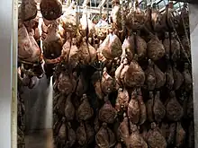 Bayonne hams aging in an atmospherically-controlled storage room in Mazerolles, Béarn