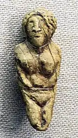 Statuette with facial features.