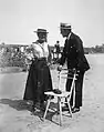 An image taken in 1912 depicting a man and woman wearing straw hats