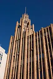 Upper portion of the eastern facade, including the tower and spire.