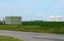 Image 119Peoples Gas Manlove Field natural gas storage area in Newcomb Township, Champaign County, Illinois. In the foreground (left) is one of the numerous wells for the underground storage area, with an LNG plant, and above-ground storage tanks are in the background (right). (from Natural gas)