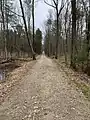 This formerly private access road was opened to the public in 2018. It is approximately 0.6 miles to the cemetery from Lower Flying Point Road