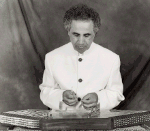 Sadeghi representing the correct hand and body posture when performing the santur