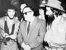 Che Guevara, Manuel Urrutia and Camilo Cienfuegos standing together