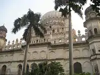 Main entrance way of Maqbara, lined with palm trees