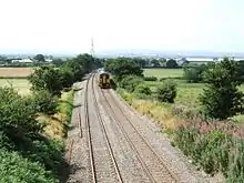 A Class 158 DMU running northwards from Shrewsbury in the direction of Crewe