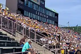 The Marching 97 performing at the stadium in 2019, note the new John J. Harmon '59 Sky Box.