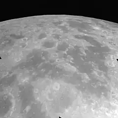 Oblique view of Mare Undarum (foreground) and Mare Spumans (upper right), facing south, from Apollo 17