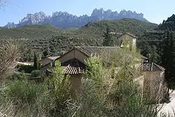 St. Stephen's church, Marganell, with Montserrat behind