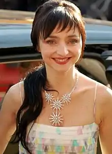 Maria de Medeiros at the 2007 Cannes Film Festival, smiling and looking to the front