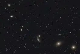 NGC 4402 visible in an image of Markarian's Chain. Click the image then move the cursor over it to reveal the location of NGC 4402.