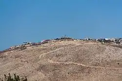 The village of Maroun al-Ras, as seen from the Israeli side of the border, near Avivim