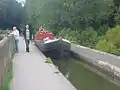 Working boat traversing Marple Aqueduct