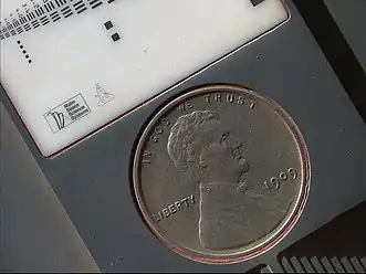 1909 VDB "US Lincoln Penny" – on the planet Mars – part of a calibration target on the Curiosity rover (September 10, 2012) (3-D version) (also, image taken on October 2, 2013 after 411 days on Mars).