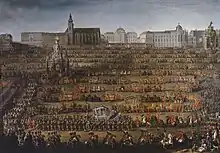 Countless carriages and horsemen are marching in front of a Viennese landscape.