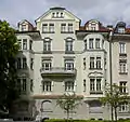 richly structured and stuccoed Art Nouveau building built by Anton Hatzl in 1906–07 with two oriels and gables at Martiusstraße 1