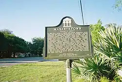 Historic plaque on the corner of US 41 & Wilson Boulevard in Masaryktown