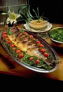 Image 1Masghouf fish, one of Iraq's national dishes, a Mesopotamian cuisine dating back to ancient times, typically fish caught from the rivers of Euphrates and Tigris, and grilled near the river bed (from Culture of Iraq)