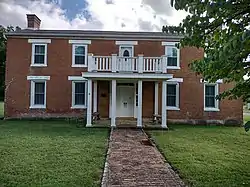 Two story red brick structure