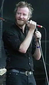 Man singing into a mic