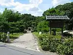 Path leading to a torii gate among trees.