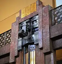 A pillar featuring the Maya rain god Chaak in the Palacio de Bellas Artes, Mexico City.