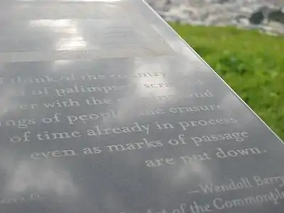 Close-up of "musing station" granite marker with quote from Wendell Berry