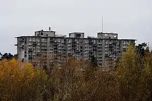 A tall, flat-roofed, 11-story dormitory