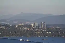 Medina, pictured front just after the Evergreen Point Floating Bridge, with the Bellevue skyline behind