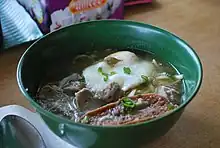 Noodle dish in green bowl