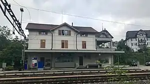 Three-story building with gabled roof