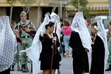 Mantilla made of white lace, during a Holy Week procession in Spain, 2006.