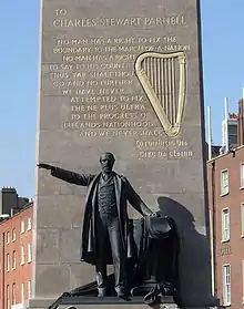 View of marble monument with a state in front