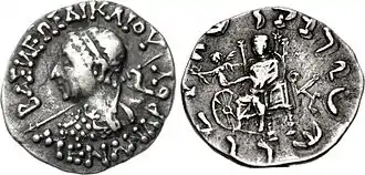 Silver Drachm of Menander II (95-80 BCE) with Zeus and Nike handing a victory wreath to a Wheel of the Law