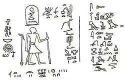 Drawing of a rock inscription showing a man standing and facing hieroglyphsStrudwick 2005, pp. 133–134.