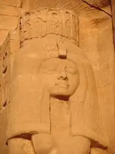 Meritamen statue at Abu Simbel next to her father large statue