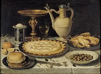 Clara Peeters (1594–1657) Table with Orange, Olives and Pie