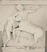 Sculpture of a man fighting a centaur.