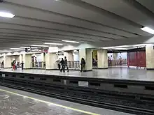 Picture of Line 9's elevated railway and below multiple transport units are parked.