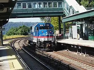 Locomotive leaving the station on the northbound tracks.