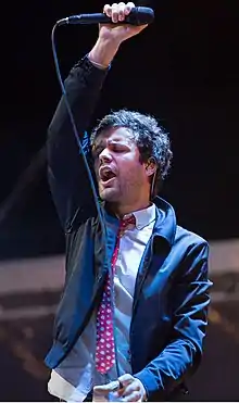 Angelakos performing with Passion Pit at Lipton's Be More Tea Festival at Riverfront Park in North Charleston, South Carolina, in 2015