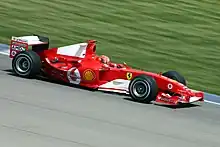 Schumacher at the 2004 United States Grand Prix driving the Scuderia Ferrari F2004 with completely white spaced Marlboro