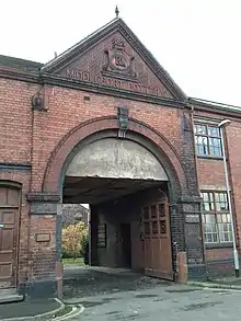 Entry to Middleport Pottery, a large brick arch bearing the name