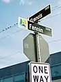 Street signs in Midtown Houston are distinct from the plain green signs seen in most of Houston