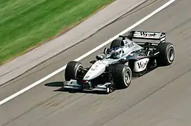 From 1997 to July 2005, McLaren switched to West. This is Mika Häkkinen driving the McLaren MP4-15 at the 2000 United States Grand Prix.