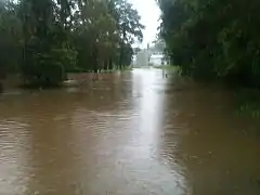 In February, the flood water rose high above the road in Mill Street, Pomona.