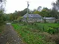 Millburn Lodge and gate on the line of the old Toll Road. A post 1858 building, home to one of the estate gamekeepers.