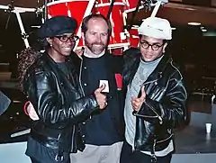 Fab Morvan (left) and Rob Pilatus (right) with NARAS president C. Michael Greene (center), February 1990