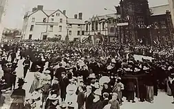 The town square of millom, filled with around 200 people. This photo was taken at the peak of Millom's significance, when it was a flourishing mining town.